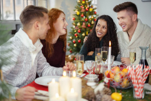 friends enjoying christmas dinner together