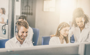 Call center worker accompanied by his team.