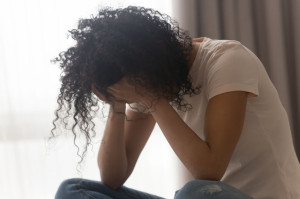 Upset black woman crying suffering from relationships problems