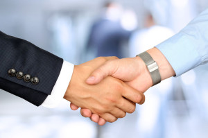 Close-up image of a firm handshake  between two colleagues