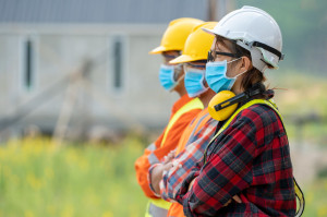 Group of Asian engineers wearing protective mask to Protect Agai