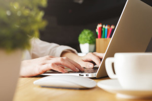 Female typing on keyboard