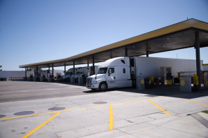 Semi Trucks with trailers are at filling station for diesel refu