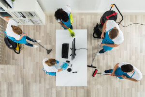 Janitors Cleaning The Office With Cleaning Equipments