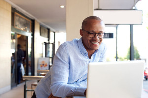 69300071 - portrait of handsome african businessman working with laptop