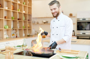 Cheerful Chef Cooking Flambe