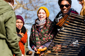 Multi-ethnic group of five young people having fun at barbecue