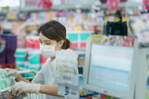 Woman protects herself from corona infection with surgical mask