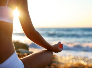 7734030 - body of a beautiful girl in a meditation on the beach