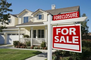 5777713 - foreclosure home for sale sign in front of beautiful house.