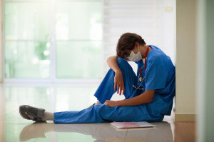 Exhausted tired doctor or nurse. Virus outbreak.