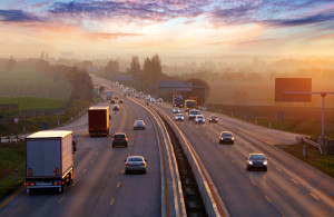 Traffic on highway with cars.