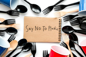 Say no to plastic copy. Eco concept and injunction on the use of plastic flatware on white background top view