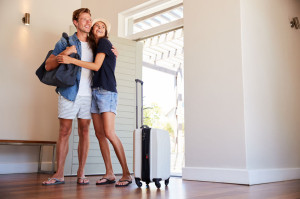 Couple Arriving At Summer Vacation Rental