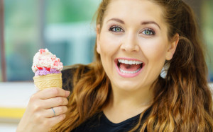 Young woman eating ice cream