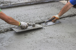 Leveling concrete with trowels