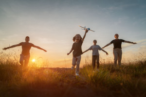 Happy family at sunset