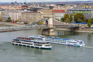 Cruise ships on Danube river under Chain bridge, Budapest, Hunga