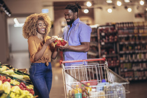 African american couple shopping for healthy fresh food at produ