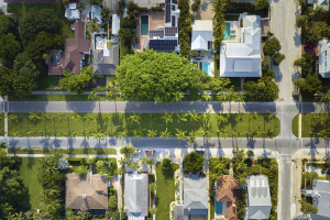 View from above of large residential houses in closed living golf club in south Florida. American dream homes as example of real estate development in US suburbs