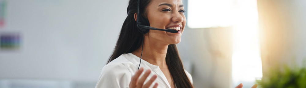 Laughing, agent or happy woman in call center consulting, speaking or talking at virtual assistant help desk. Smile, friendly or funny sales consultant in telemarketing customer services or telecom