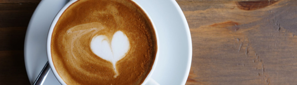 hot lattee art top view , heart and copyspace, beverage concept.