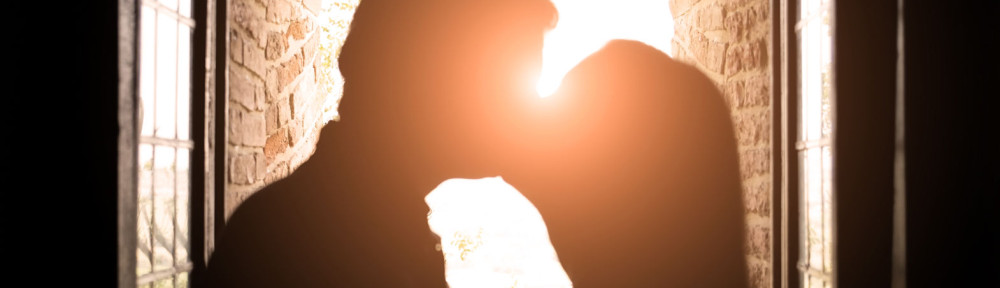 Romantic kiss at sunset