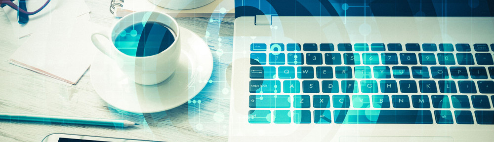 Business workplace with laptop coffee cup and security concept o