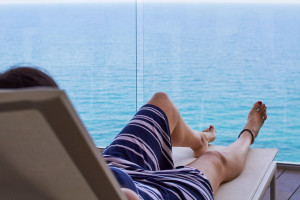 woman relaxing on a deck chair