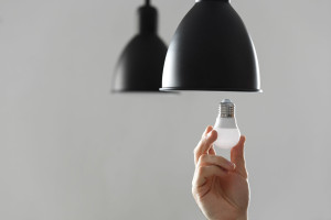 Changing the bulb for led bulb in floor lamp in black colour. On