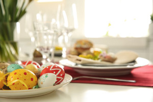 Festive Easter table setting with decorated eggs, closeup