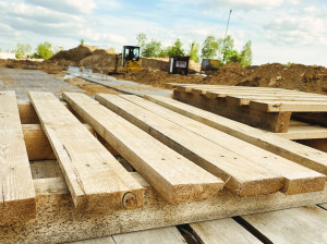 wooden pallets at the construction site. natural material for carrying heavy objects at the construction site. pallet made of yellow with a smooth surface
