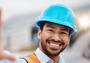 Construction worker, selfie and portrait with helmet outdoor of builder and maintenance employee. Happy, face and male person doing engineering, property planning and building development project