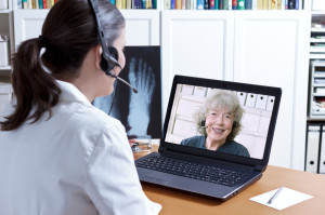 doctor x-ray laptop patient telehealth