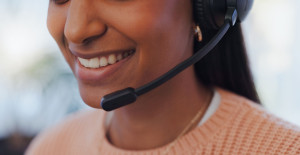 Call center, mouth and businesswoman with microphone for telemarketing, support and consulting as service. Office, closeup and female advisor with headset for listening, answer questions and helping
