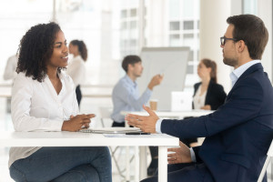 Multiracial businesspeople working together in shared office