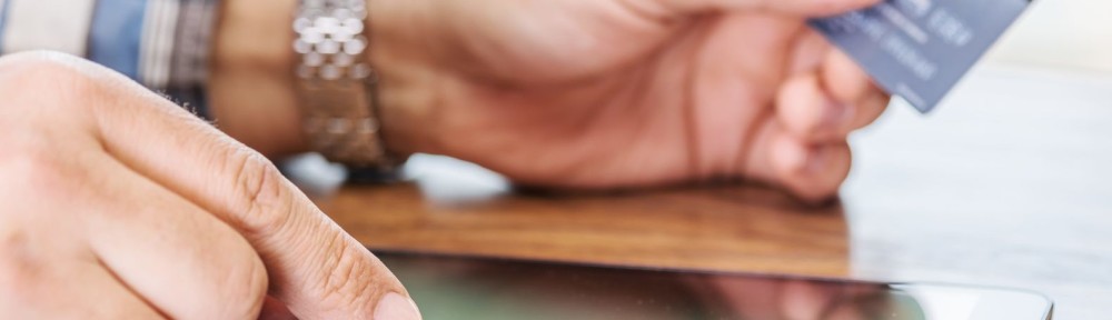 84378126 - online shopping using credit card and tablet computer.