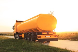 208476334 - modern yellow truck parked on country road